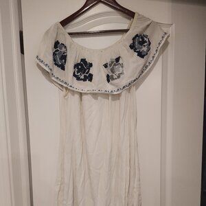 White off the shoulder dress with embroidered blue flowers